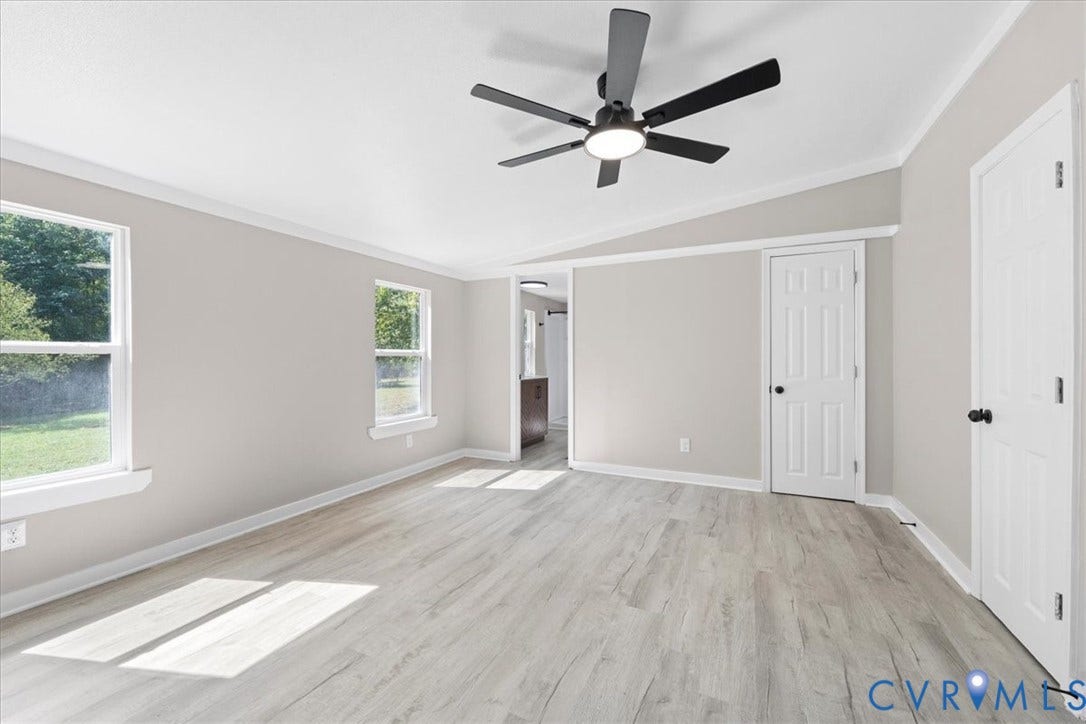 115 Mount Airy Lane, Cumberland, VA 23040 Light gray wood-finish flooring complements the white trim and neutral wall color
