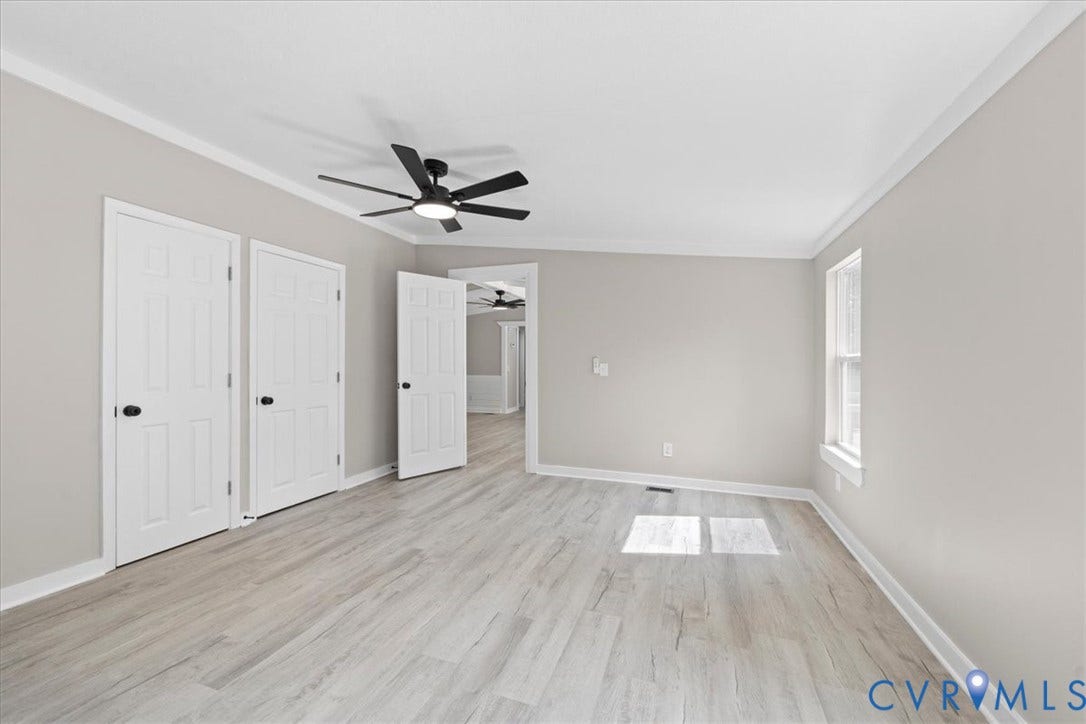 115 Mount Airy Lane, Cumberland, VA 23040 Light wood-finish flooring with neutral wall paint, crown molding, and a ceiling fan