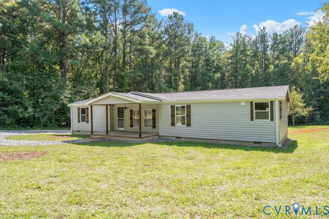 115 Mount Airy Lane, Cumberland, VA 23040 Single-story residence featuring light-colored siding and a covered front porch with dark-toned support columns