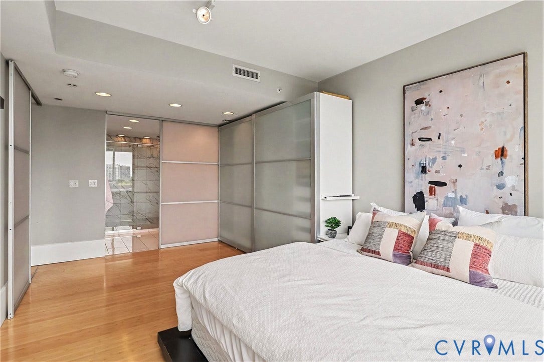 1101 Haxall Point, #U512 U510, Richmond, VA 23219 Recessed ceiling lighting, wood-finish flooring, built-in wardrobe with frosted glass panels, and an integrated tall storage unit