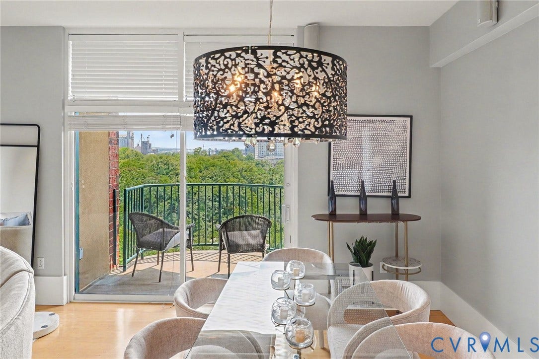 1101 Haxall Point, #U512 U510, Richmond, VA 23219 Wood-finish flooring, sliding glass door with balcony access, and a decorative pendant light fixture