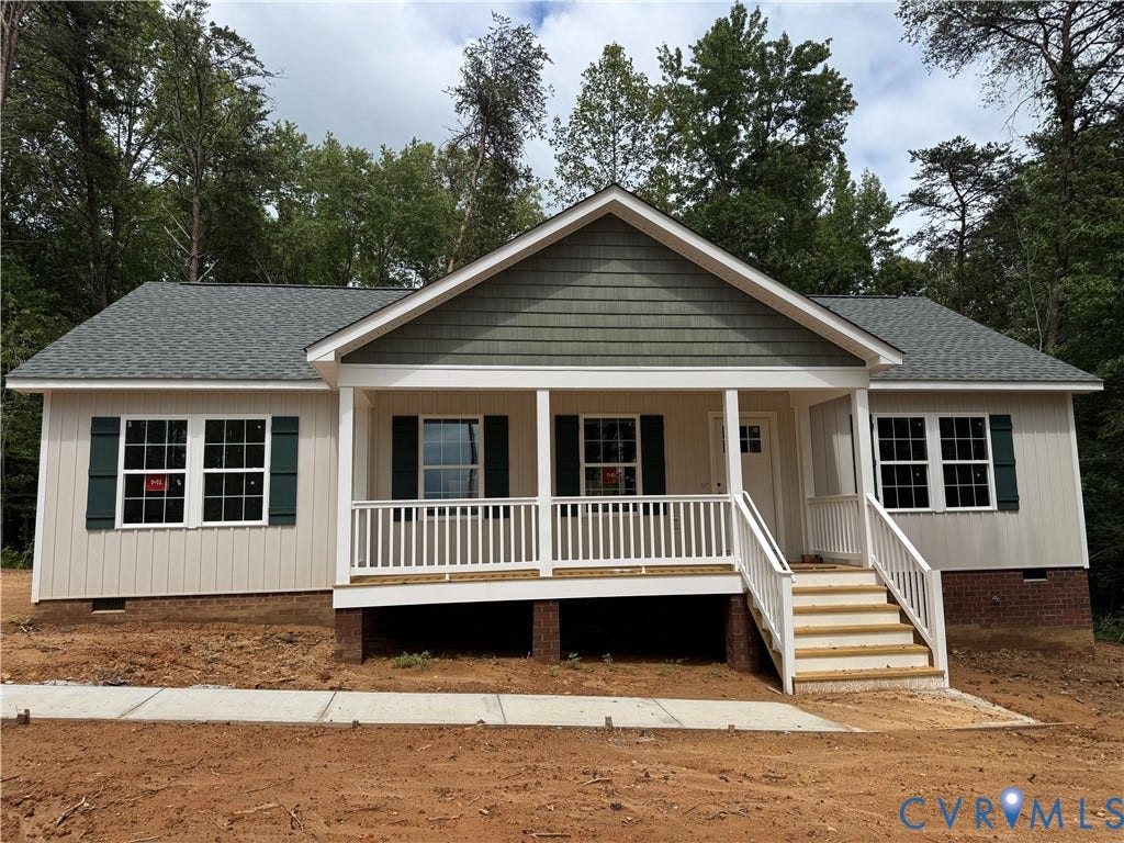 7735 Jefferson Highway, Cedar Hill Park, Mineral, VA 23117 Ranch-style exterior with a covered front porch, white railings, and a light-colored siding