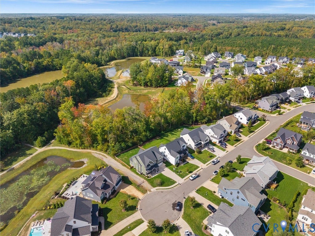 Residential cul-de-sac with manicured lawns and mature trees