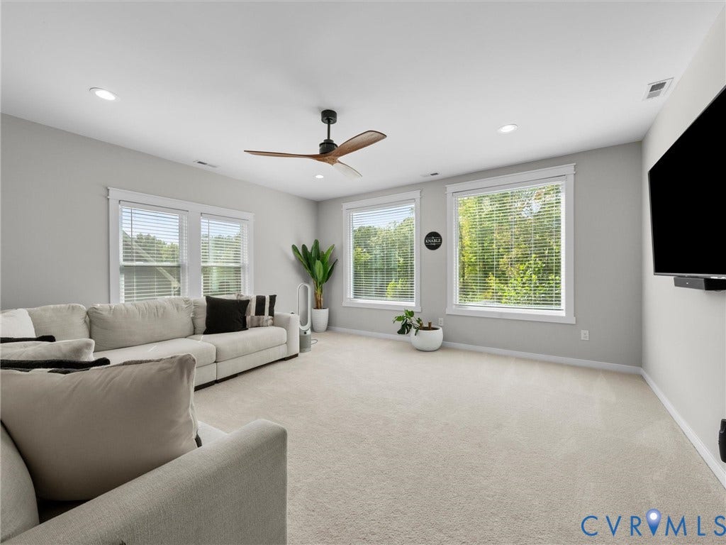 Recessed lighting, ceiling fan, and carpeted flooring