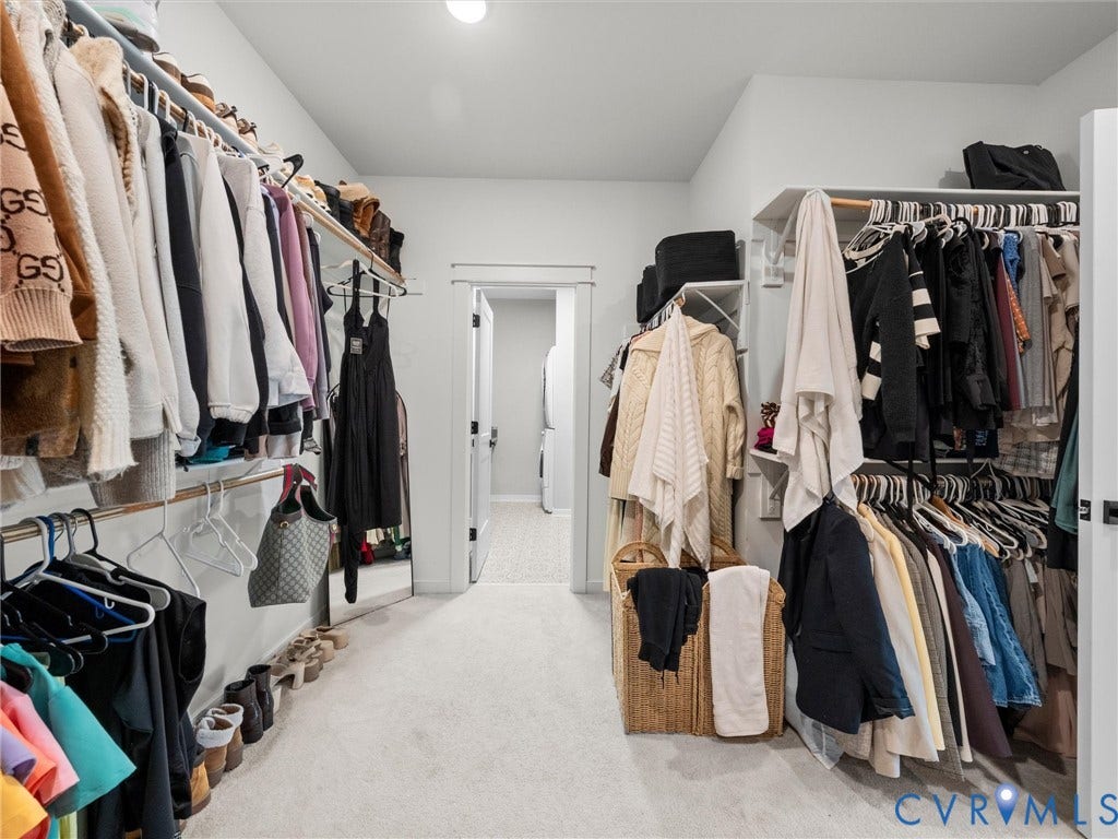 Built-in closet system with shelving and hanging rods