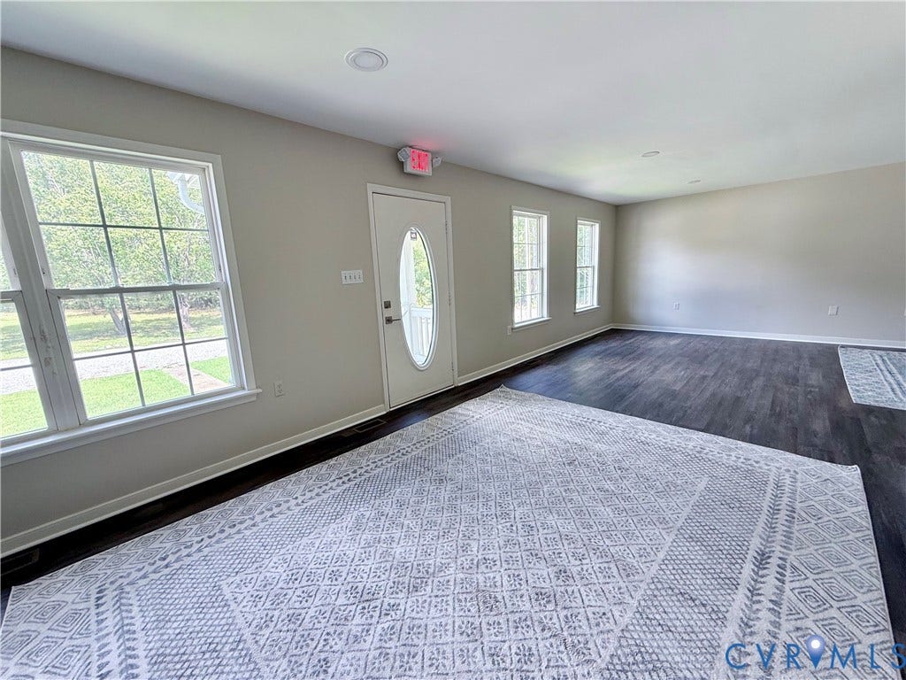 2091 Anderson Highway, Powhatan, VA 23139 Beautiful entry! Wood-finish flooring, multiple windows, recessed lighting and elegant rug