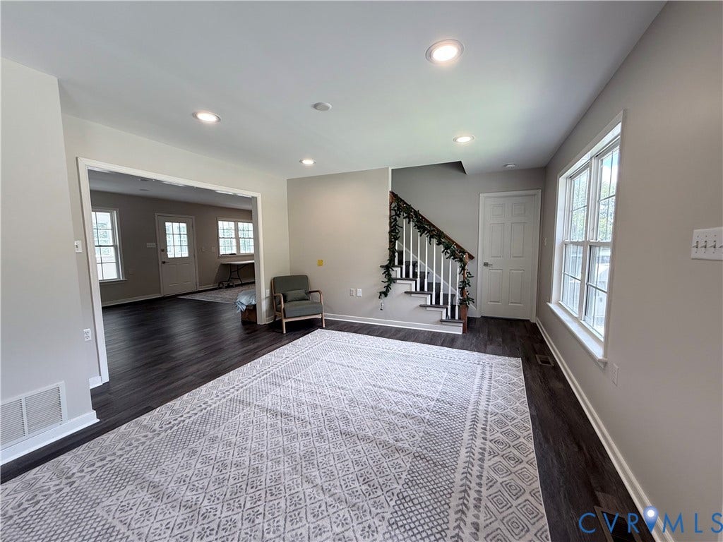 2091 Anderson Highway, Powhatan, VA 23139 Recessed lighting, wood-finish flooring, white trim, and a staircase with white risers and dark treads