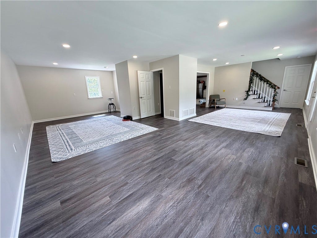 2091 Anderson Highway, Powhatan, VA 23139 Expansive open-concept room featuring wood-finish flooring, recessed lighting, and neutral wall tones