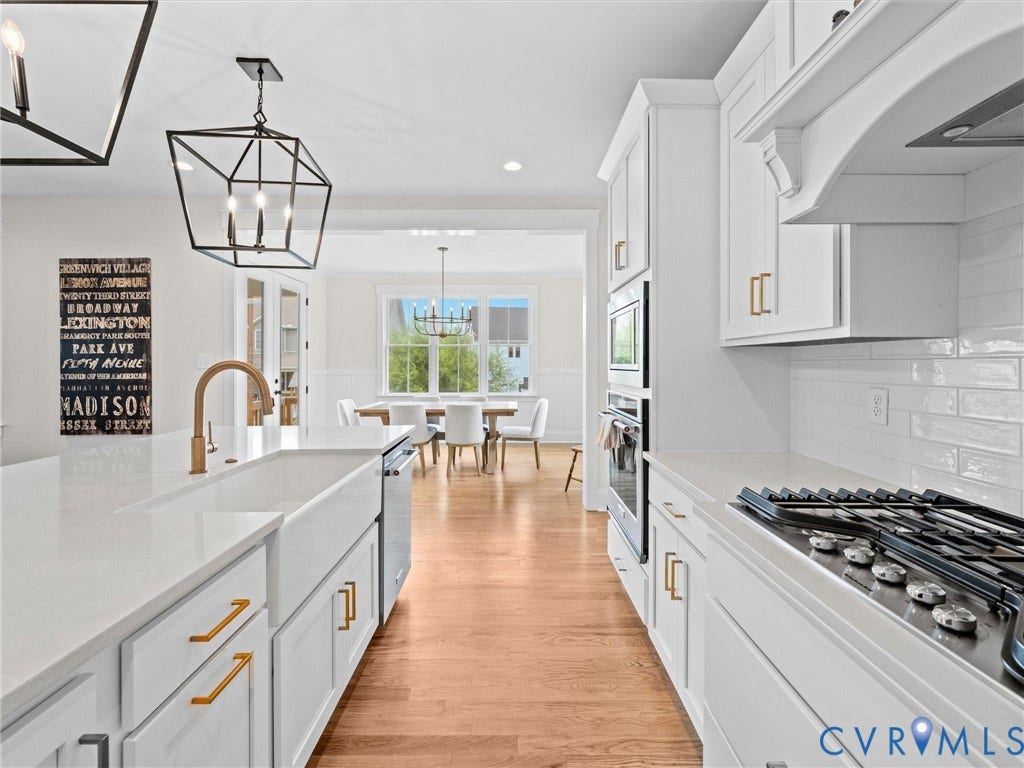 3719 Bellstone Drive, Midlothian, VA 23112 Kitchen featuring white cabinetry, light-toned countertops, a built-in range, a single basin sink, and wood-finish flooring