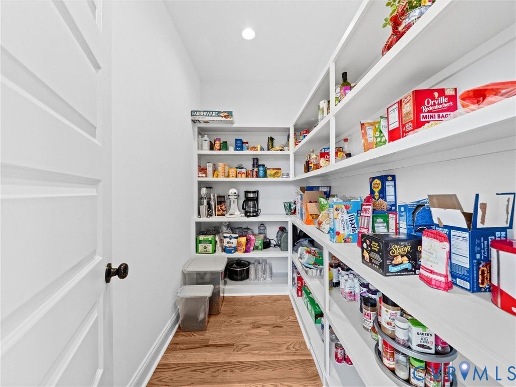 3719 Bellstone Drive, Midlothian, VA 23112 Walk-in pantry featuring extensive built-in shelving, recessed lighting, and wood-finish flooring
