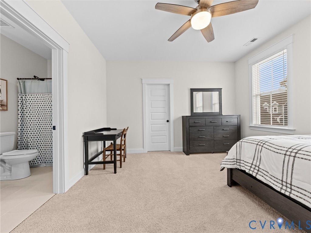3719 Bellstone Drive, Midlothian, VA 23112 Neutral carpeted flooring, a window with blinds, a ceiling fan with integrated lighting, and an ensuite bathroom.