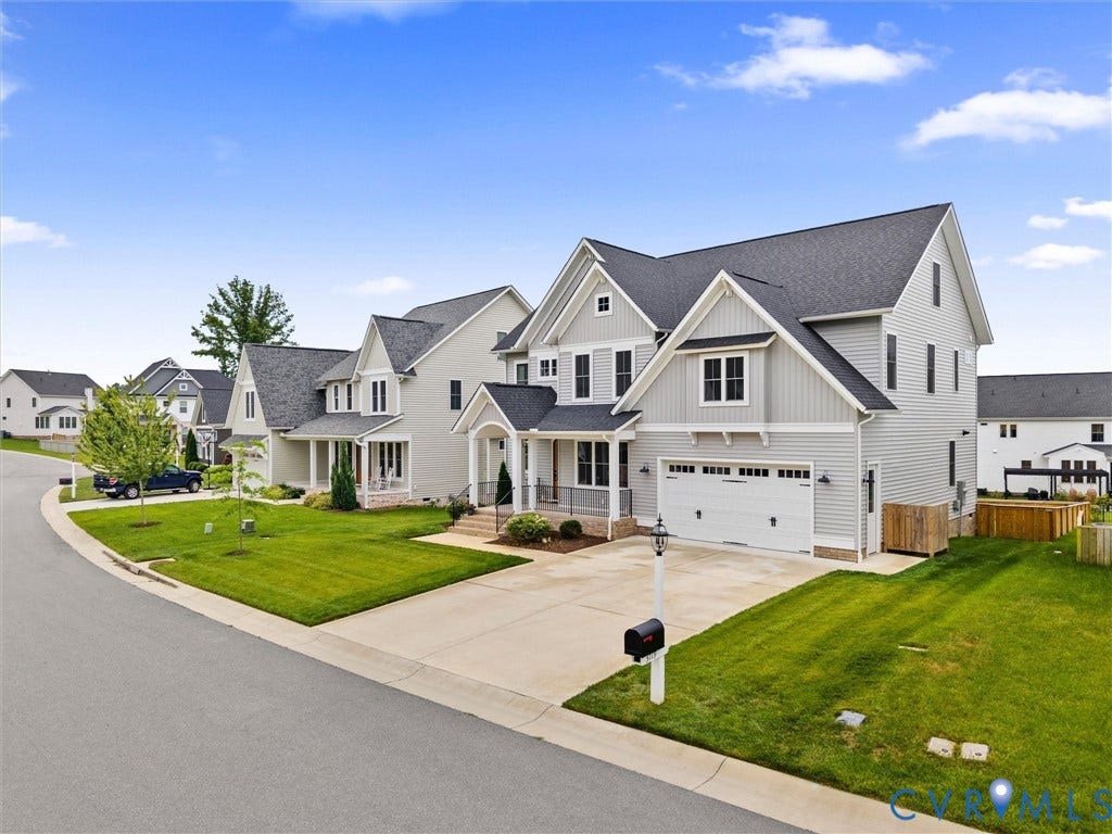 3719 Bellstone Drive, Midlothian, VA 23112 Contemporary home featuring a dual garage, light gray siding, dark gray shingle roof, and a concrete driveway
