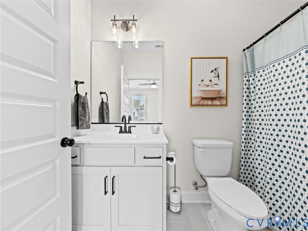 3719 Bellstone Drive, Midlothian, VA 23112 Ensuite Bathroom in BR #2 with White vanity with integrated sink, black faucet, and coordinating hardware