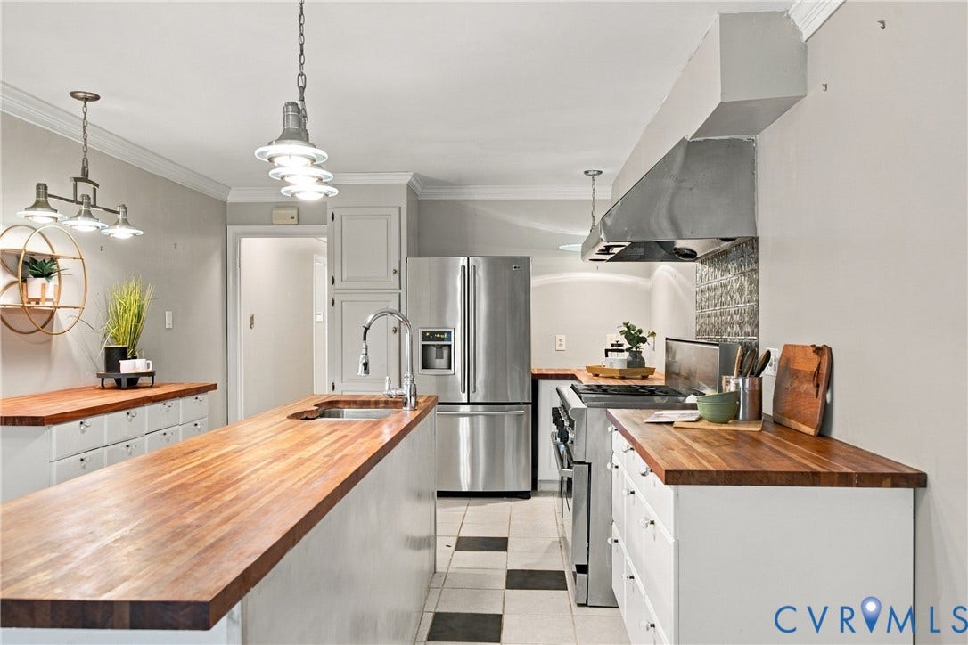 9015 Wood Sorrel Drive, Henrico, VA 23229 Kitchen featuring wood countertops, white cabinetry, stainless steel professional-style range, stainless steel range hood, and pendant lighting