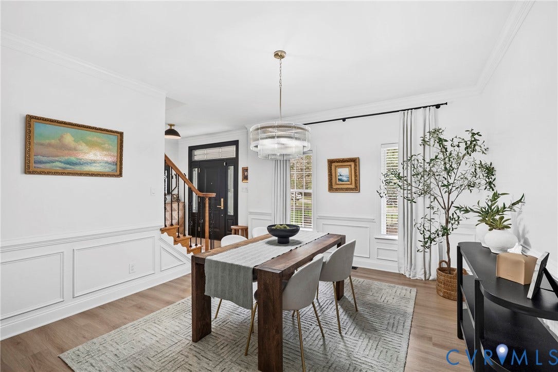 8406 Chandon Court, Chesterfield, VA 23838 Wood-finish flooring, wainscoting, crown molding, and a built-in chandelier