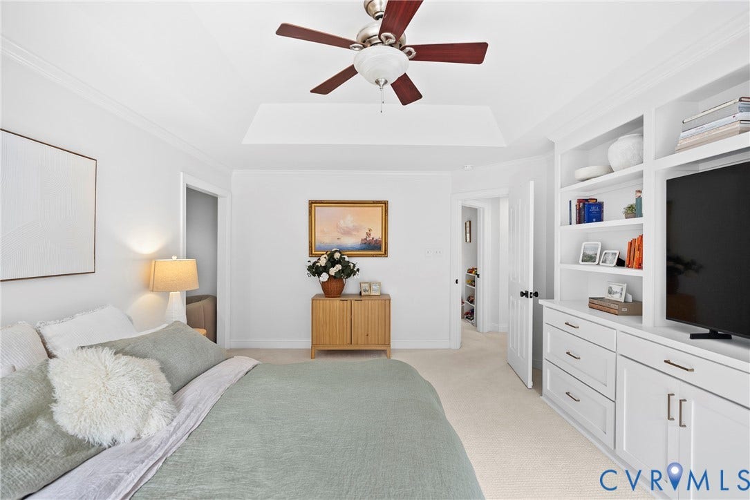 8406 Chandon Court, Chesterfield, VA 23838 White built-in cabinetry with integrated shelving and drawers, tray ceiling, ceiling fan, and light-toned carpet