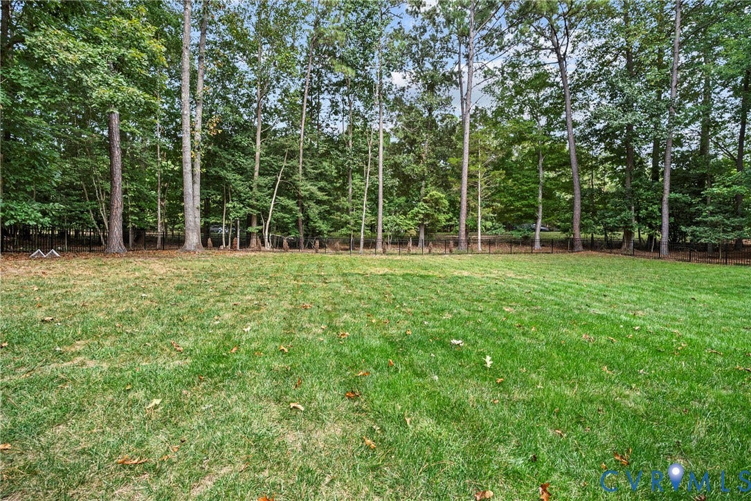 8406 Chandon Court, Chesterfield, VA 23838 Expansive grassy area featuring mature trees and perimeter fencing