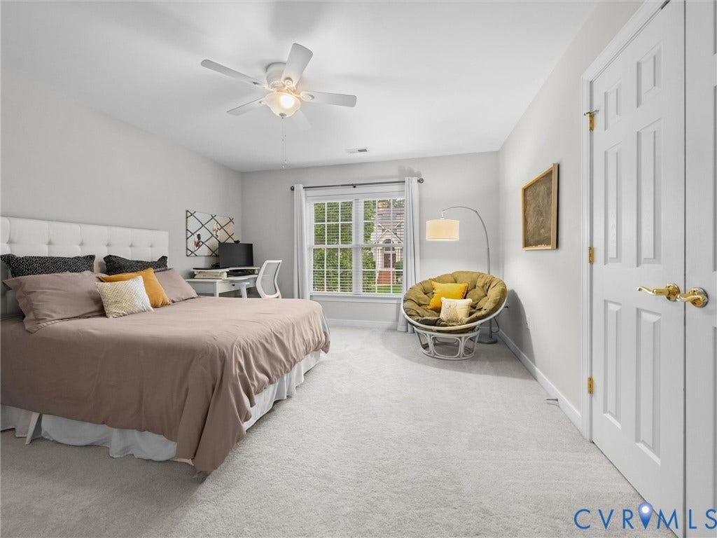 14779 Rolling Spring Drive, Charter Colony, Midlothian, VA 23114 Generously sized and filled with natural light, this spacious guest bedroom offers plenty of room for a sitting or study area, with soft neutral finishes and ample closet space creating a comfortable, versatile retreat #