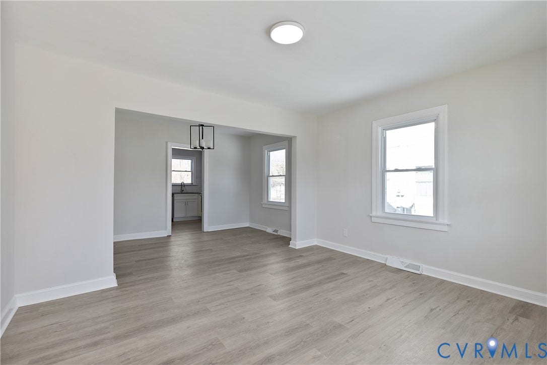 1305 Overlook Street, Richmond, VA 23224 Wood-finish flooring, recessed lighting, white trim, and multiple windows