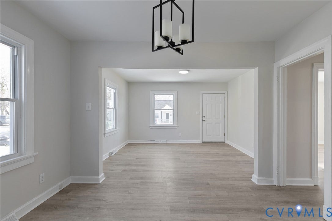 1305 Overlook Street, Richmond, VA 23224 Open-concept living area featuring wood-finish flooring, recessed lighting, and a modern chandelier