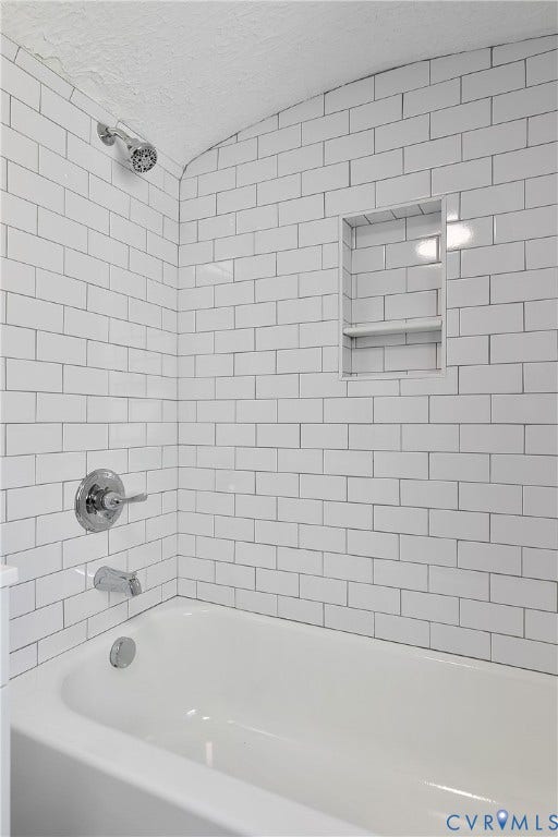 1305 Overlook Street, Richmond, VA 23224 White subway tile shower surround with a built-in niche and chrome fixtures