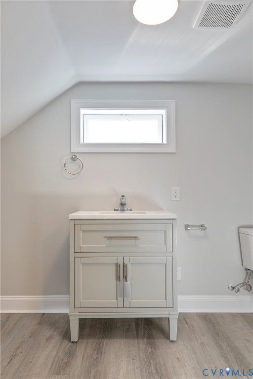 1305 Overlook Street, Richmond, VA 23224 Vanity with integrated sink, contemporary hardware, and wood-finish flooring