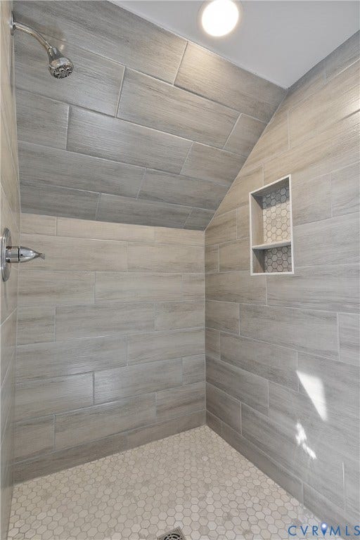 1305 Overlook Street, Richmond, VA 23224 Walk-in shower with wood-finish tile walls and a hexagonal tile floor