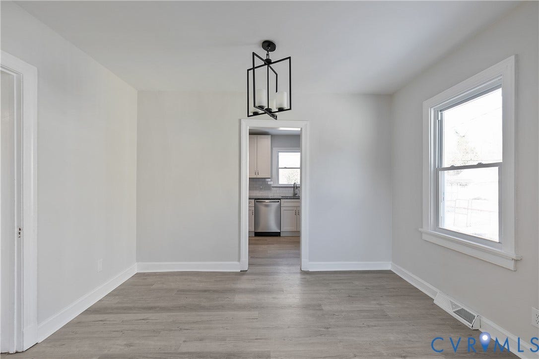 1305 Overlook Street, Richmond, VA 23224 Wood-finish flooring with white trim and light gray walls