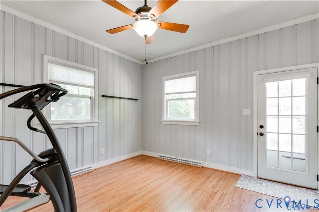 2304 Buckingham Avenue, Henrico, VA 23228 Wood-finish flooring, beadboard wall paneling, ceiling fan with light fixture, and a glass-paned door