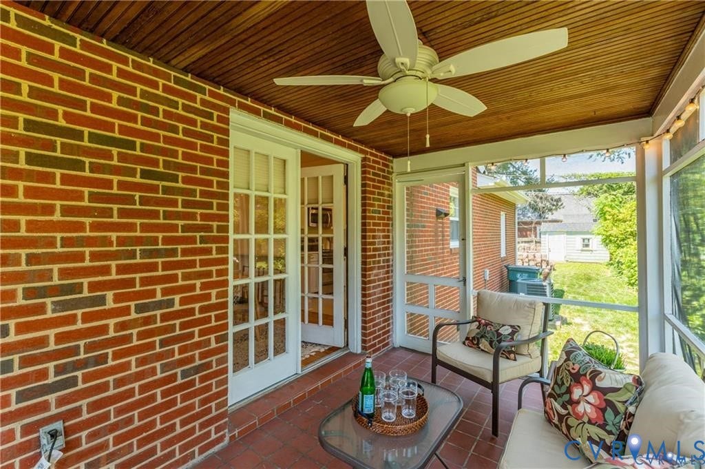 2304 Buckingham Avenue, Henrico, VA 23228 Screened porch with a wood-paneled ceiling, brick flooring, and a ceiling fan