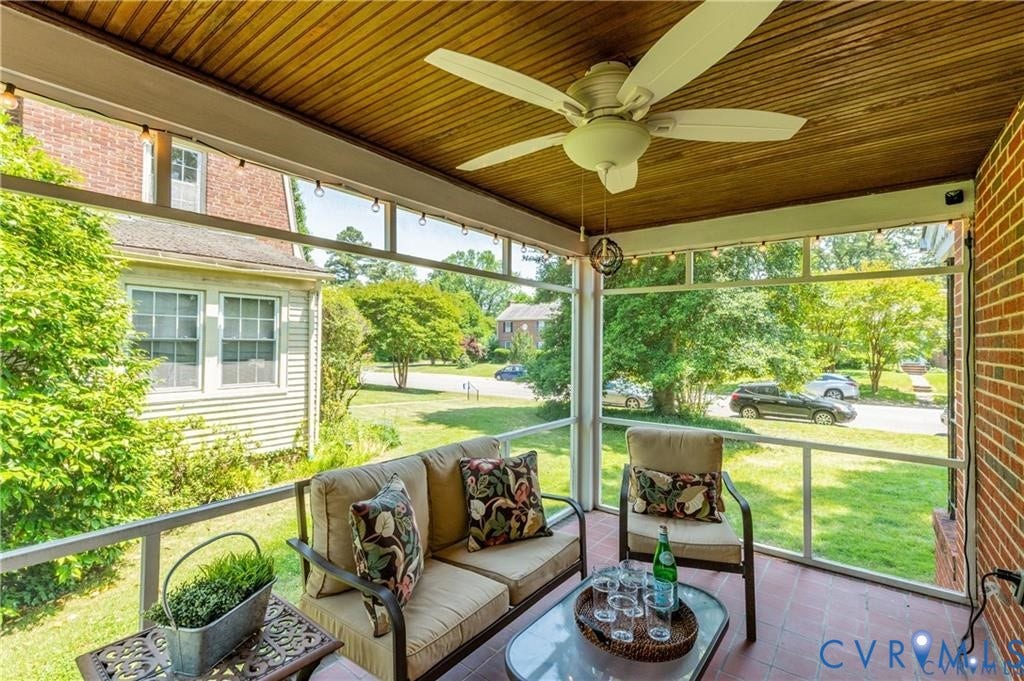2304 Buckingham Avenue, Henrico, VA 23228 Screened porch with wood-finish ceiling, ceiling fan, string lighting, and terra cotta tile flooring