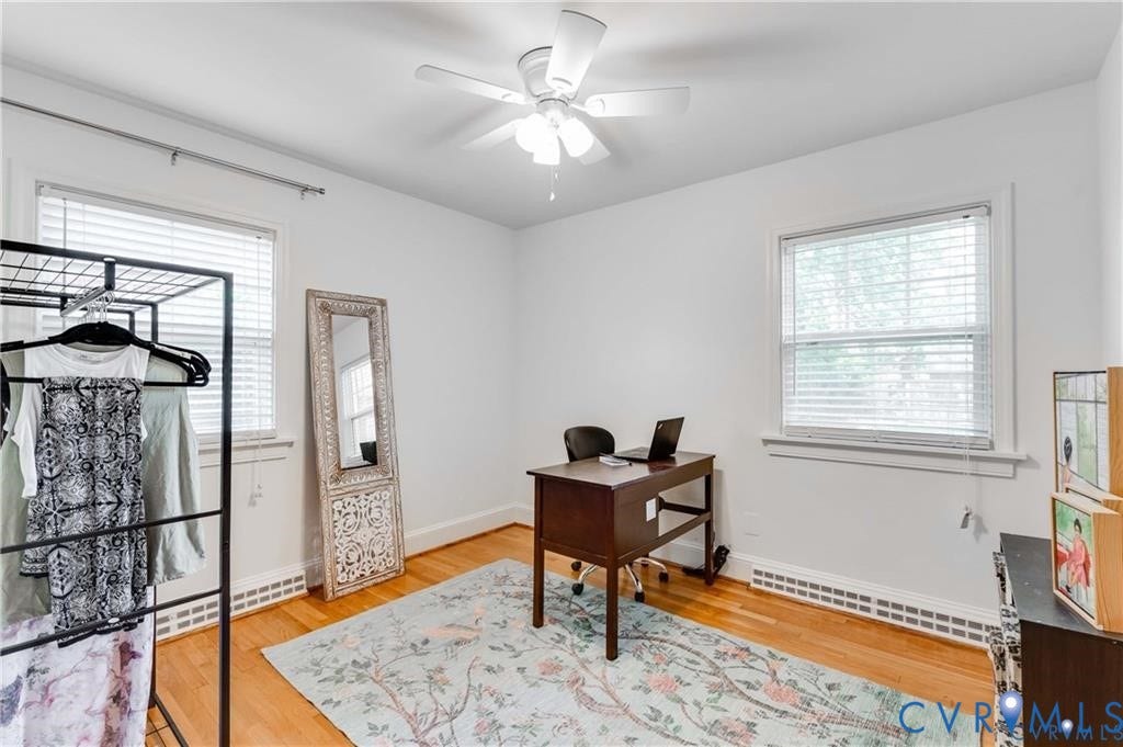 2304 Buckingham Avenue, Henrico, VA 23228 Hardwood flooring, white walls, two windows with blinds, and ceiling fan with integrated lighting