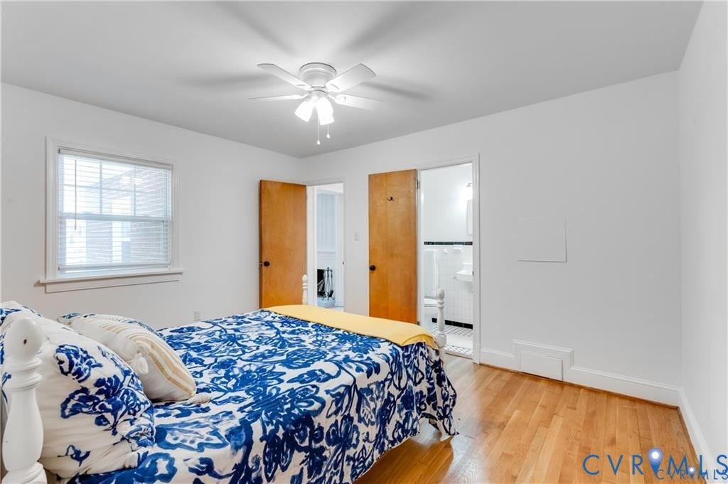 2304 Buckingham Avenue, Henrico, VA 23228 Hardwood flooring, white walls, white ceiling fan with light, white trim, and a window with blinds