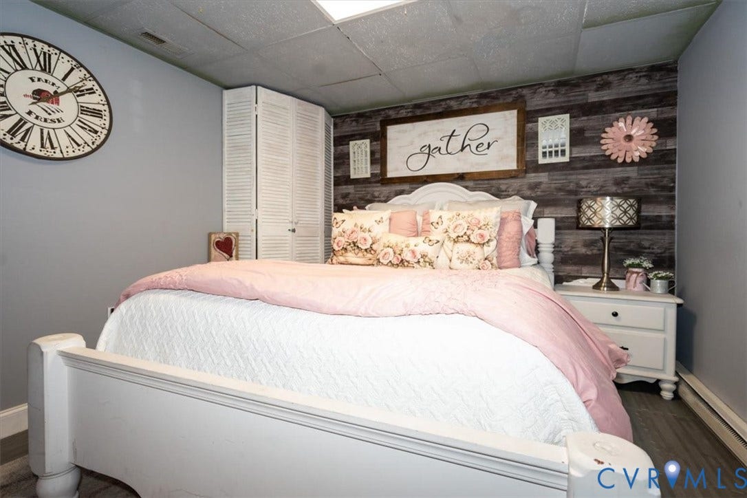 5510 Alberta Road, Stanwick, Midlothian, VA 23832 Shiplap accent wall, drop ceiling, painted paneling, wood-finish flooring, white built-in cabinetry