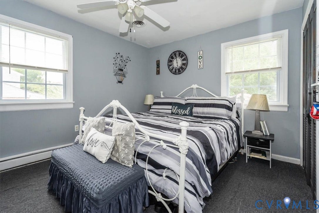 5510 Alberta Road, Stanwick, Midlothian, VA 23832 White ceiling fan, two windows with white trim, light gray walls, dark gray carpet, and dark louvered closet doors