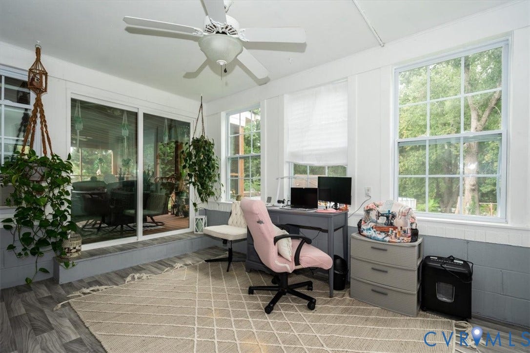 5510 Alberta Road, Stanwick, Midlothian, VA 23832 Room featuring wood-finish flooring, white ceiling fan, multiple windows, and a sliding glass door