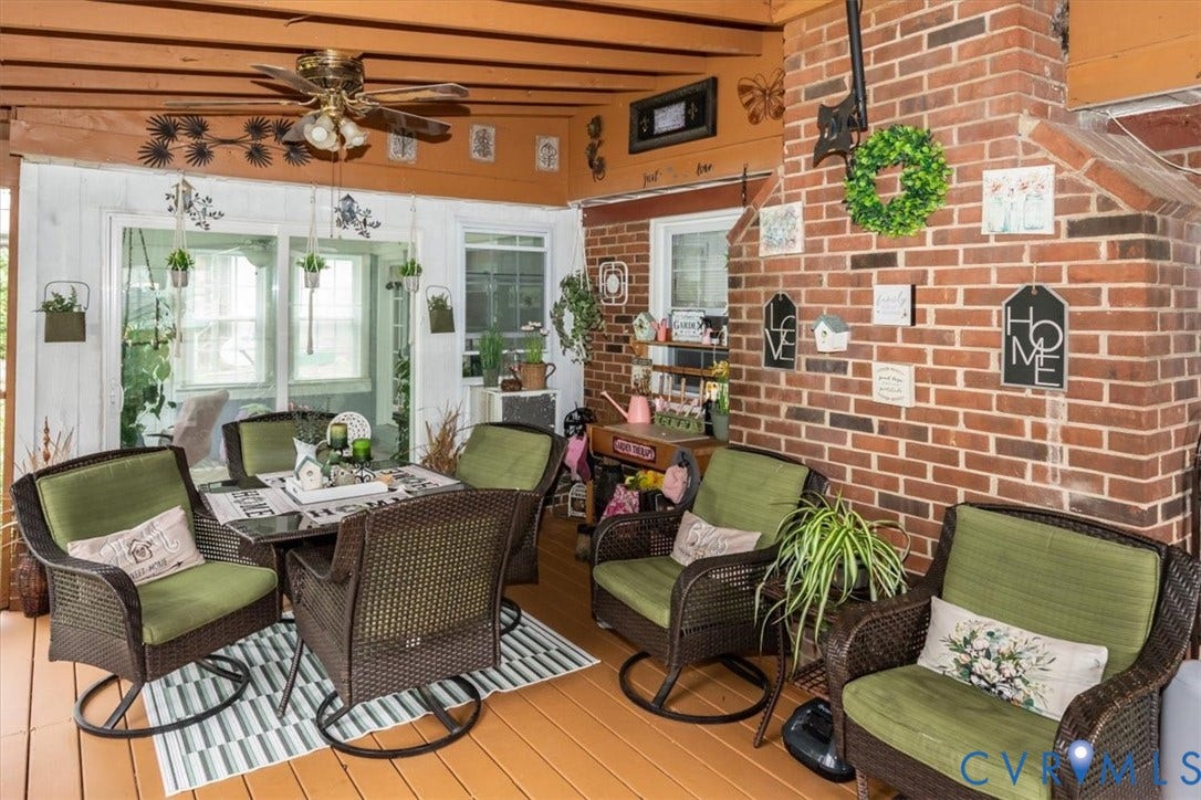 5510 Alberta Road, Stanwick, Midlothian, VA 23832 Enclosed porch featuring a brick accent wall, wood-finish flooring, exposed wood beams, and a ceiling fan with integrated lighting