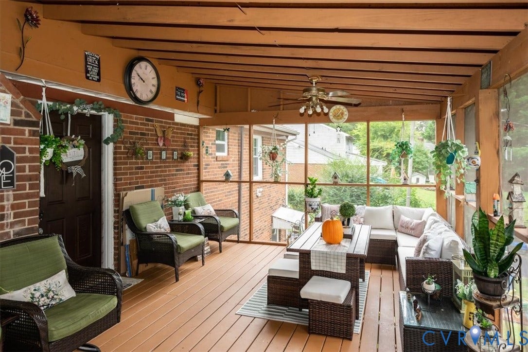 5510 Alberta Road, Stanwick, Midlothian, VA 23832 Screened porch with wood-finish flooring, exposed beam ceiling, brick wall accent, and ceiling fan