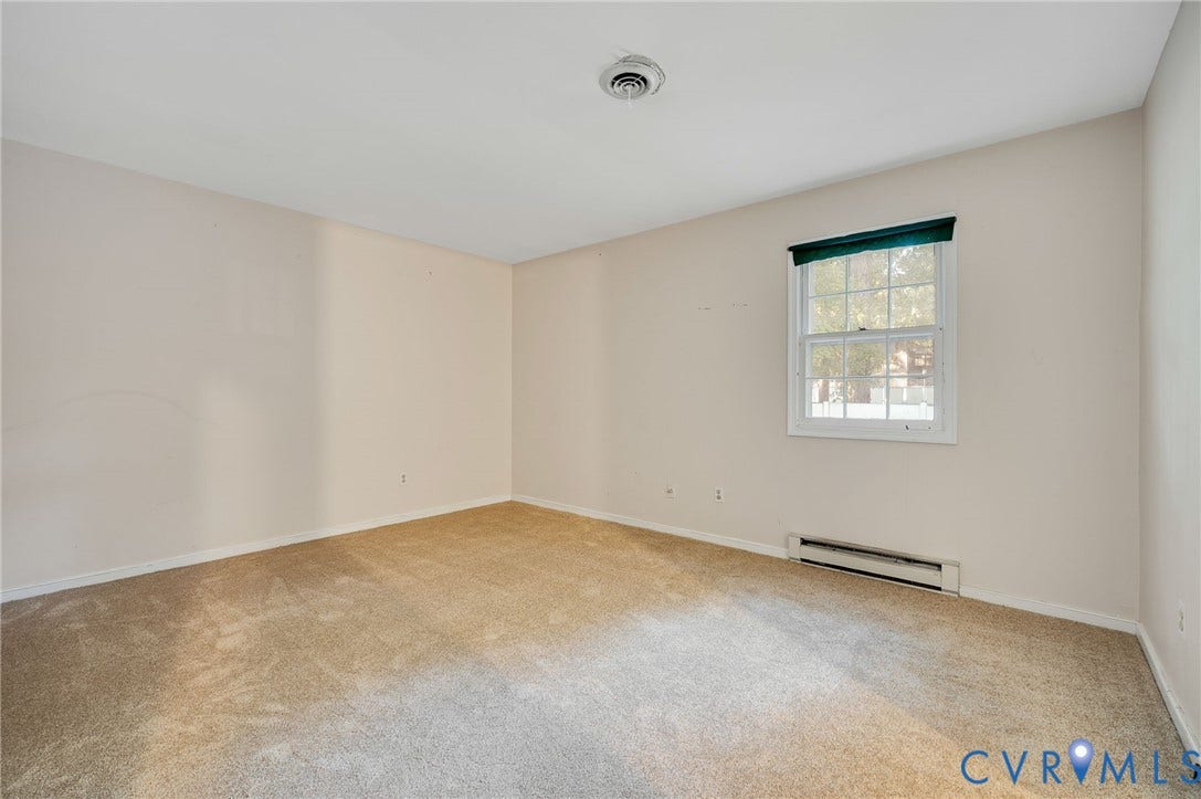 Carpeted flooring with painted walls