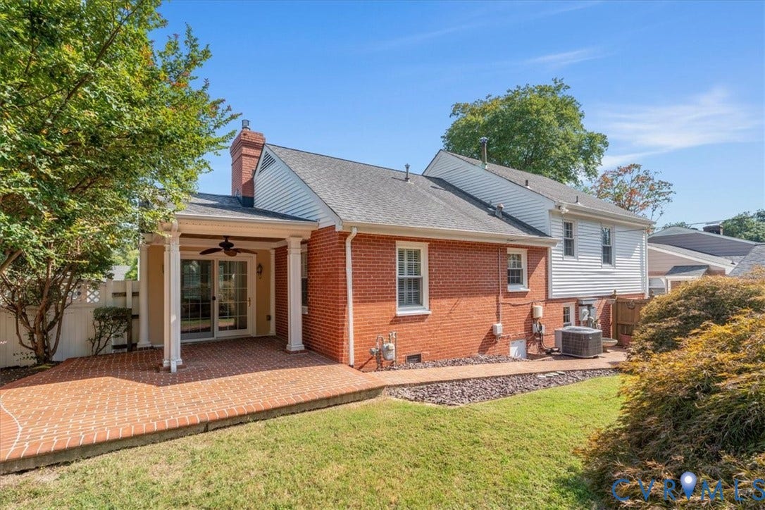 Large brick patio opens to the sun room