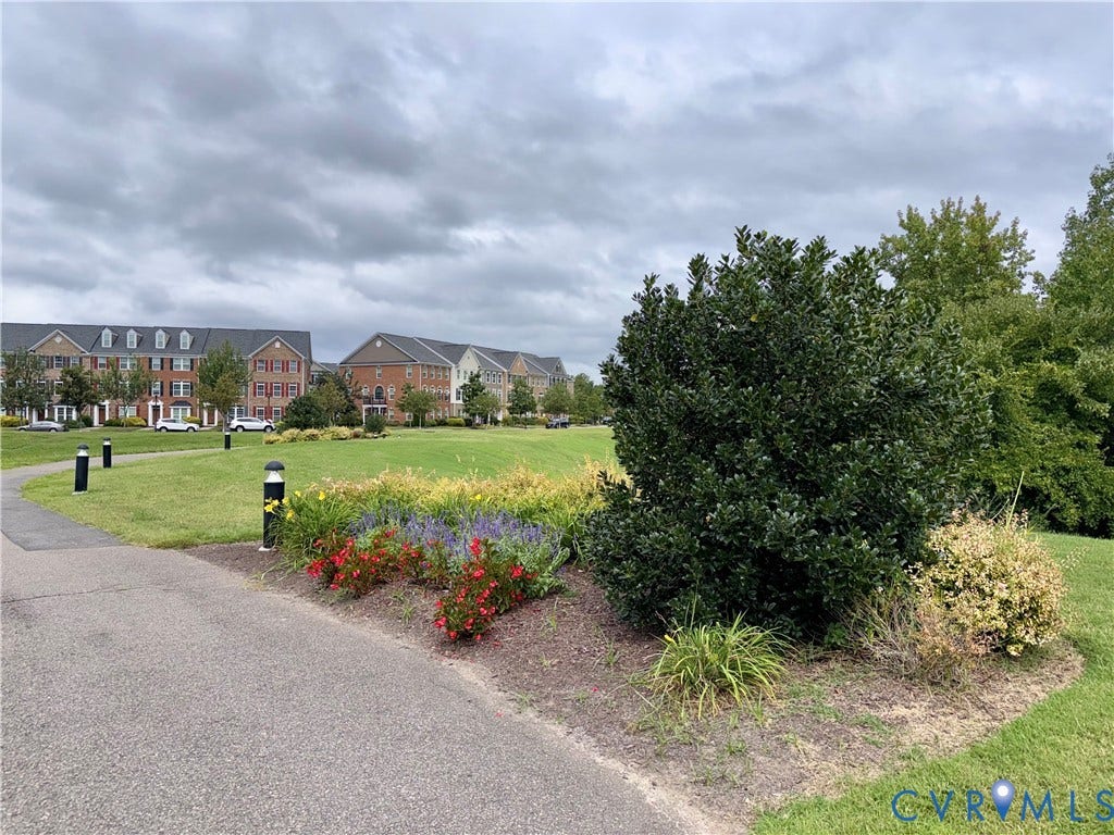 3900 Liesfeld Place, Glen Allen, VA 23060 Community green space featuring a paved pathway, manicured lawns, and varied landscaping