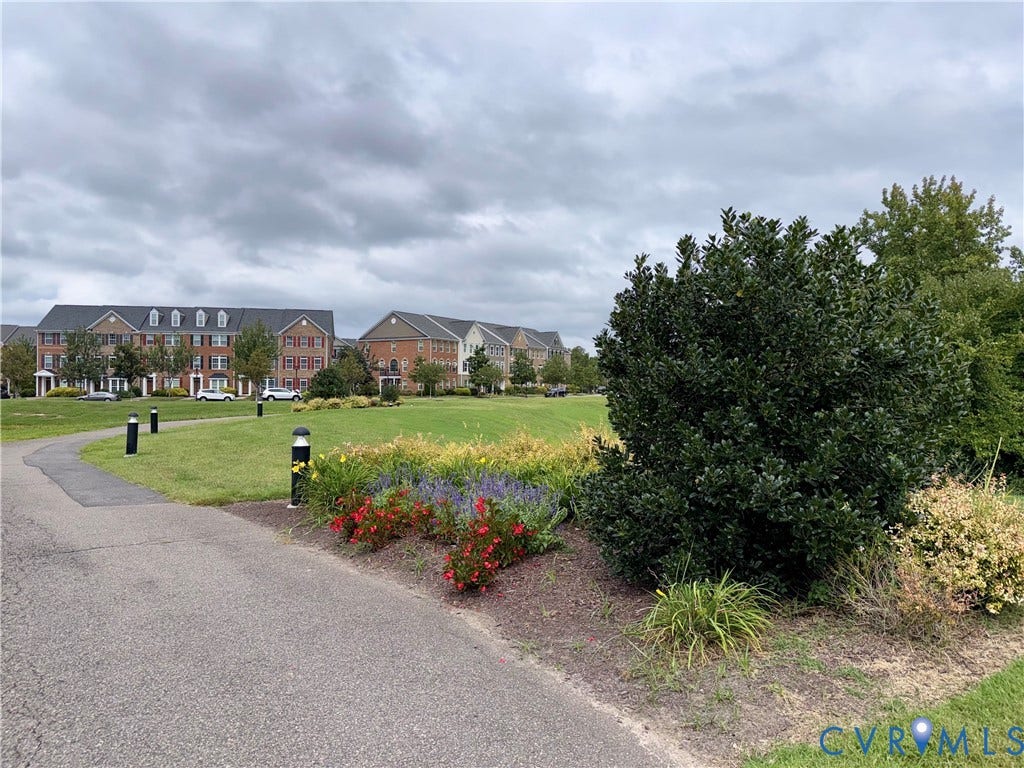 3900 Liesfeld Place, Glen Allen, VA 23060 Paved pathway bordered by landscaped garden beds, green lawn, and mature foliage