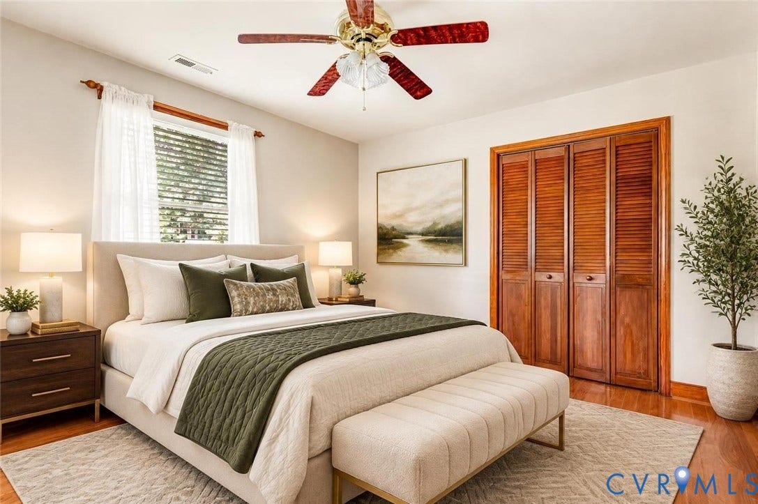 Hardwood flooring, ceiling fan, and louvered bifold closet doors