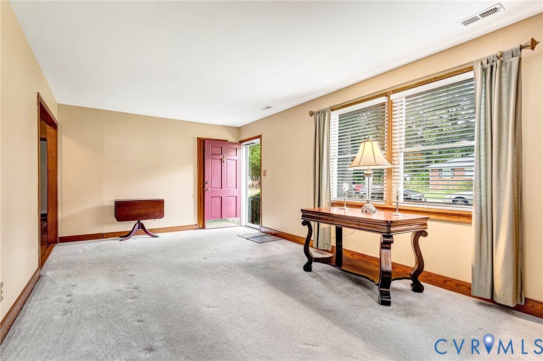 Greet friends at the front door that opens into the large Living Room