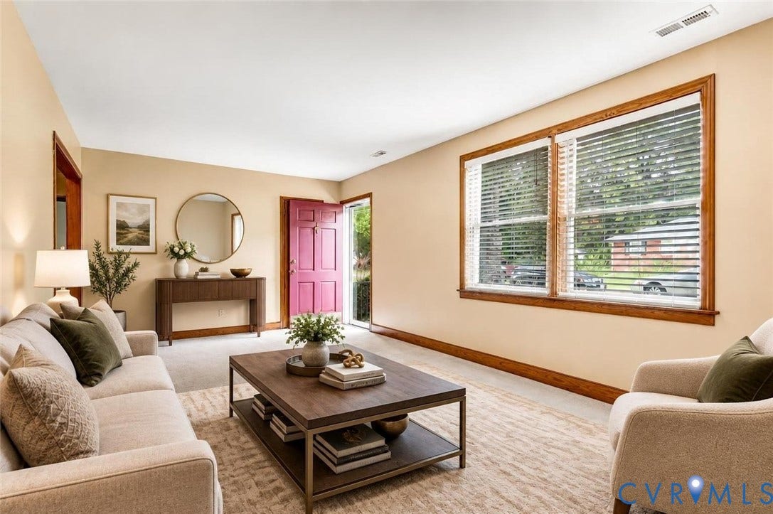 What if you furnished the Living Room like this?  Spacious living area featuring light-toned walls, wood trim, and large windows with blinds