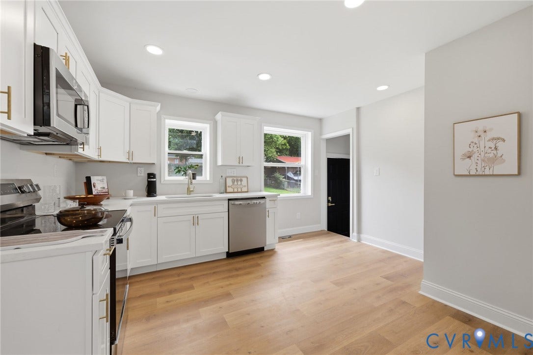 Kitchen featuring white shaker cabinetry, stainless steel appliances, light wood-finish flooring, recessed lighting, and a white countertop