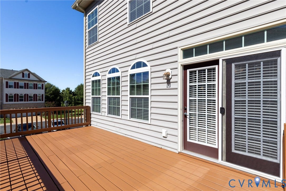 Exterior decking with wood-finish planks and matching railing