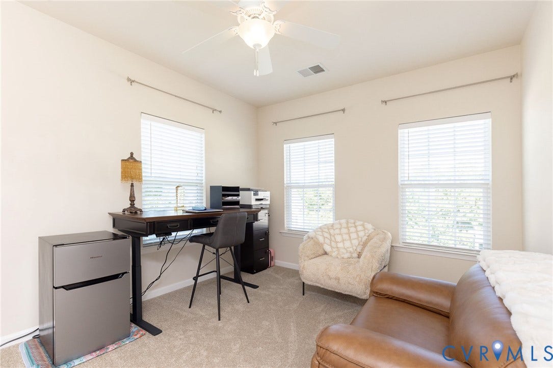 Recessed lighting, three windows with white blinds, and a ceiling fan with light fixture