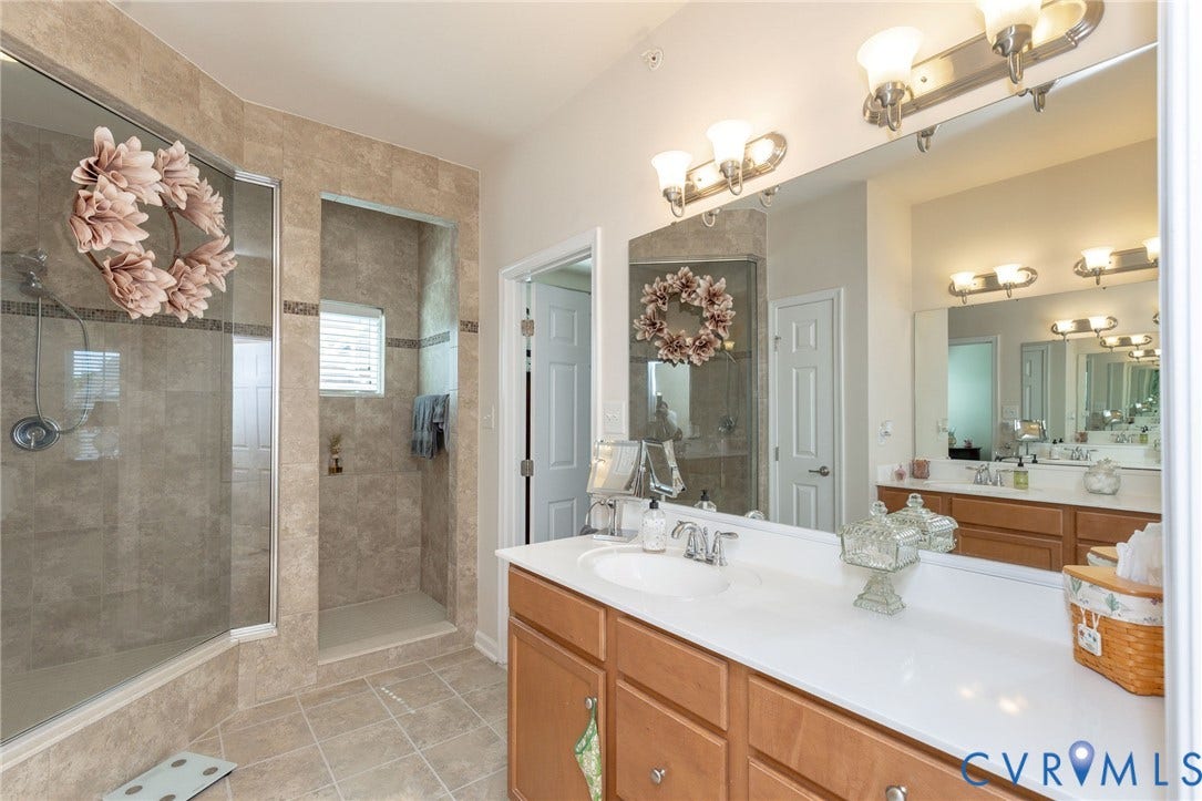 Dual vanity with integrated sinks and wood-finish cabinetry