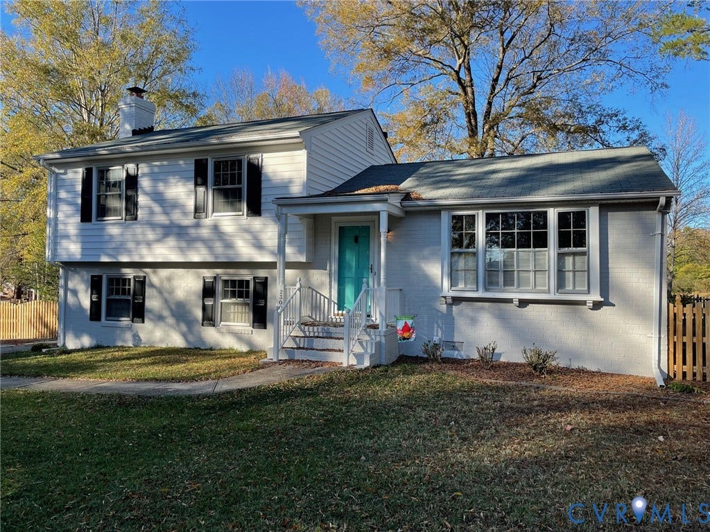 2300 Pleasant Run Drive, Henrico, VA 23238 Split-level exterior featuring white siding and a brick foundation